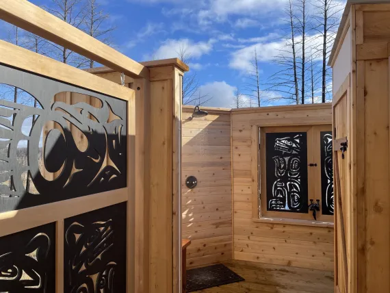 Cedar clad outdoor shower in the Canvas Cabin on the Ridge at Siwash Lake