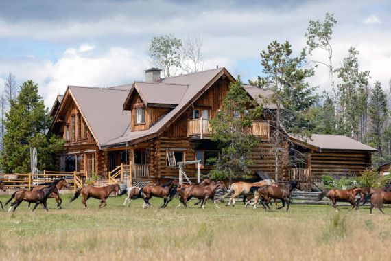 An iconic luxury wilderness lodge - the main log Ranch House at Siwash Lake