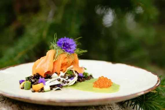 A classic luxury lodge dinner, trout caught sustainably in the wild and smoked in-house at this luxury ranch retreat..