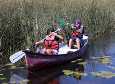 childrens program with kids canoeing