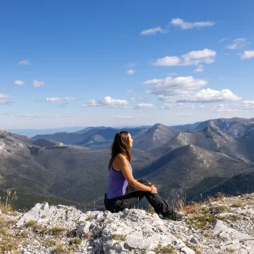 Enjoying the views from the summit on the all day Alpine Hike Adventure