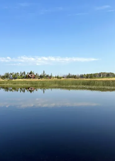 A panoramic western vista of the ranch overlooking Siwash Lake