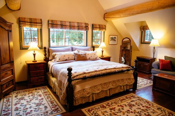 The master bedroom of the Siwash Suite in the main Ranch House at Siwash Lake