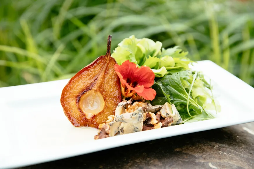 Roasted pear on garden greens