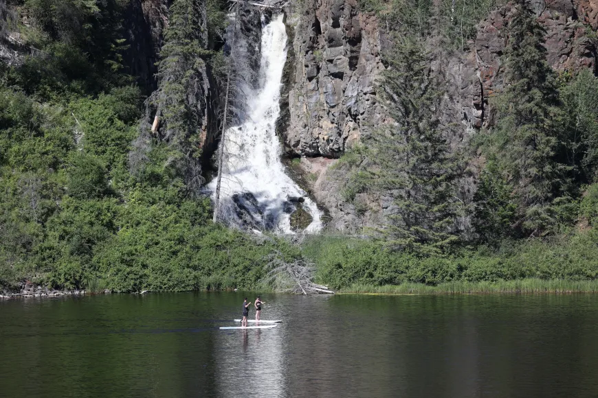 Paddle board to waterfalls at Siwash Lake Luxury Resort & Ranch
