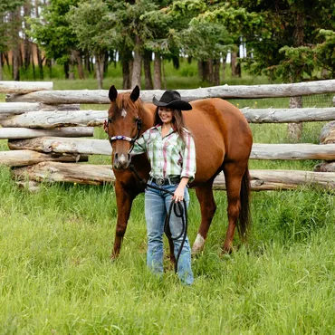A woman connects with her horse during a personalized riding vacation at Siwash Lake